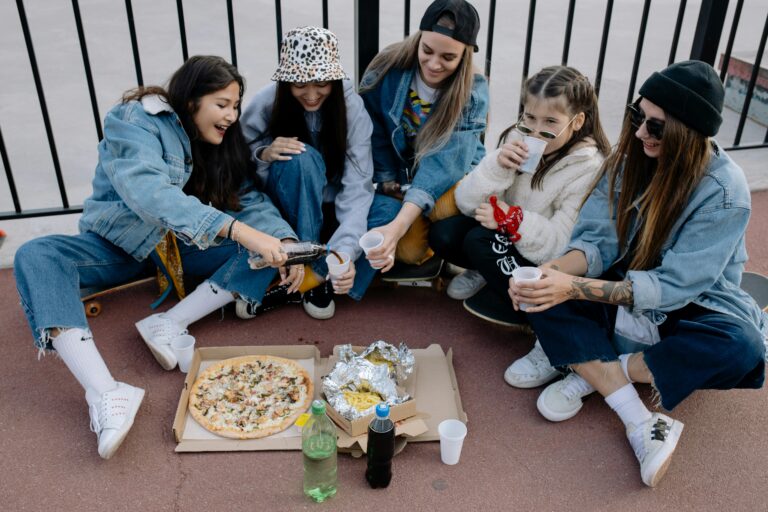 Group of friends laughing and enjoying a meal together