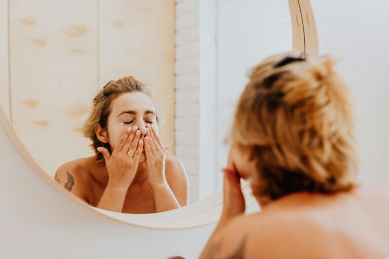 person washing face with gentle cleanser