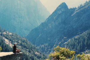 Person meditating in a serene environment